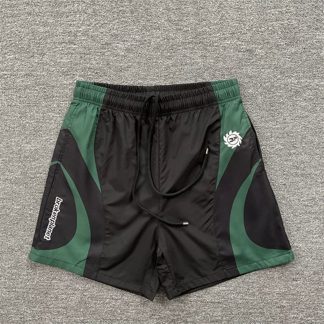 Broken Planet Black Green Curved Panel Nylon Shorts Hover Image