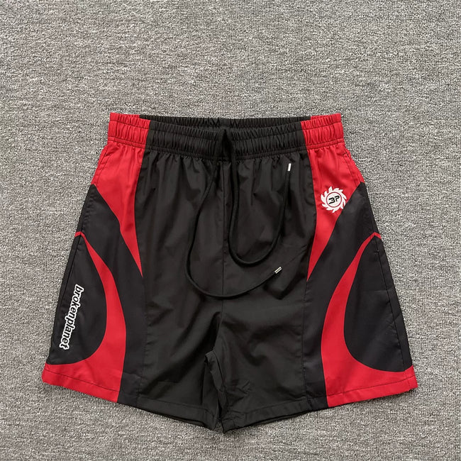 Broken Planet Black Red Curved Panel Nylon Shorts Hover Image
